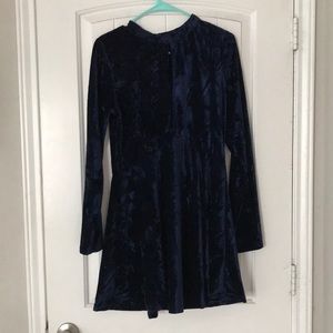 Crushed blue velvet dress with open neck flourish